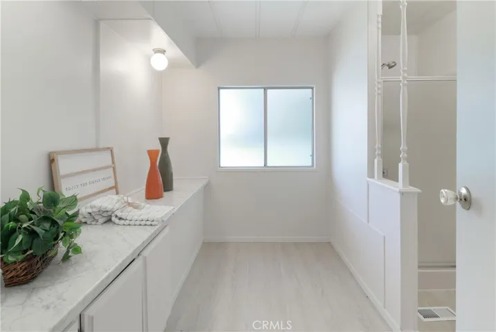 Primary Bathroom With New Countertops, Paint and Flooring