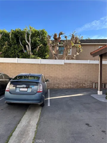 Two adjacent parking spaces (not tandem)