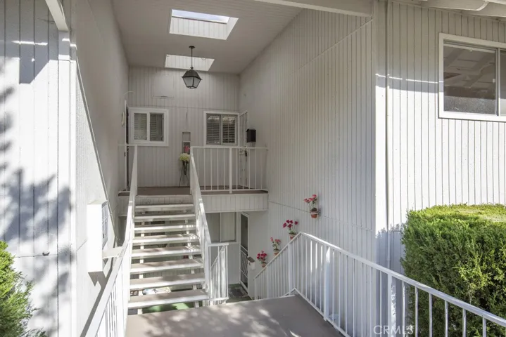 Close-up of entry to the residence. Unit "O" is at the top of the stairs on the right.
