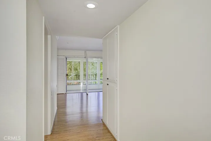 Hallway leading from entry to the living room and kitchen.