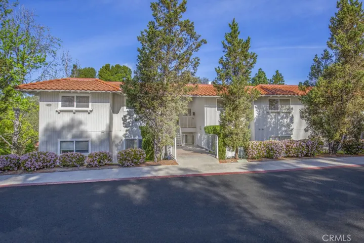 Welcome to 658-O Avenida Sevilla - a two-bedroom, two-bath, upper-level CASTILLA floorplan with just over 1000 sq. ft. of living space in the Laguna Woods senior community.