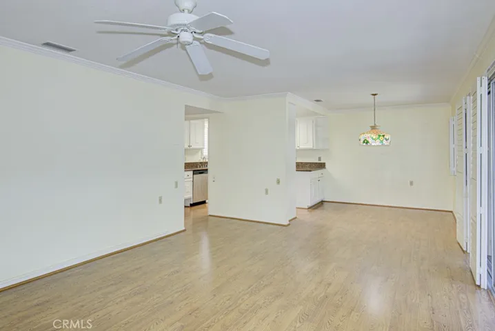 Another view of the living room looking towards the dining area and kitchen.
