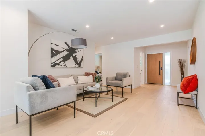 Living room showcasing the home's open floor plan and indoor-outdoor connection.