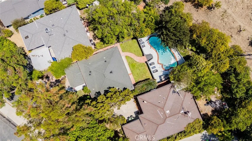 Aerial view showcasing the usable lot and pool.