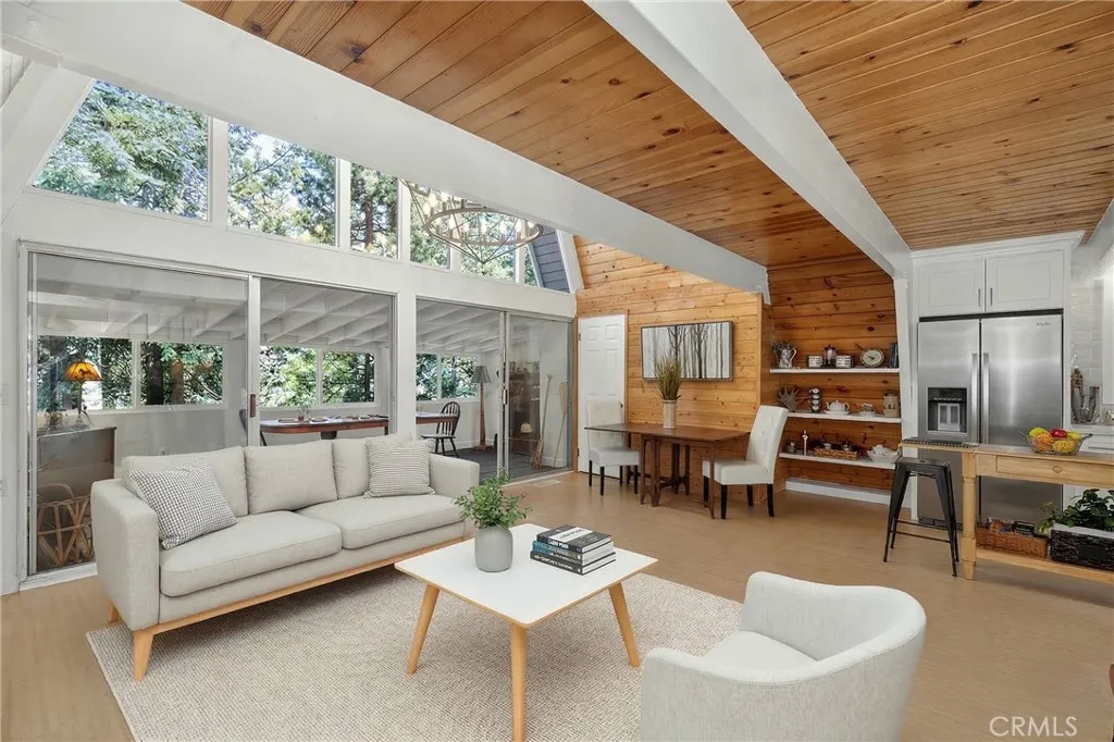Sofa, coffee table, chair and rug are virtually staged.