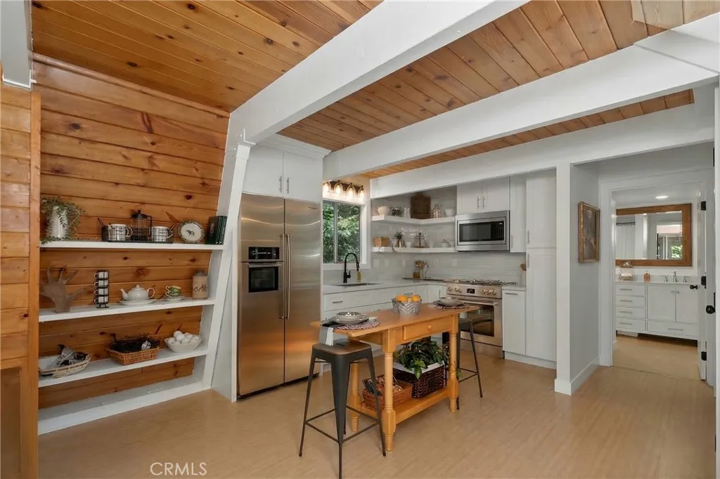 Refrigerator, microwave, stove are virtually staged.