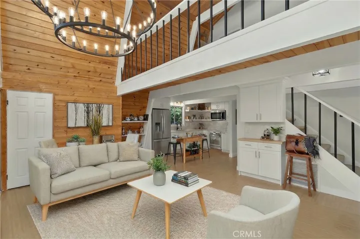 Virtually staged sofa, coffee table, chair, area rug.