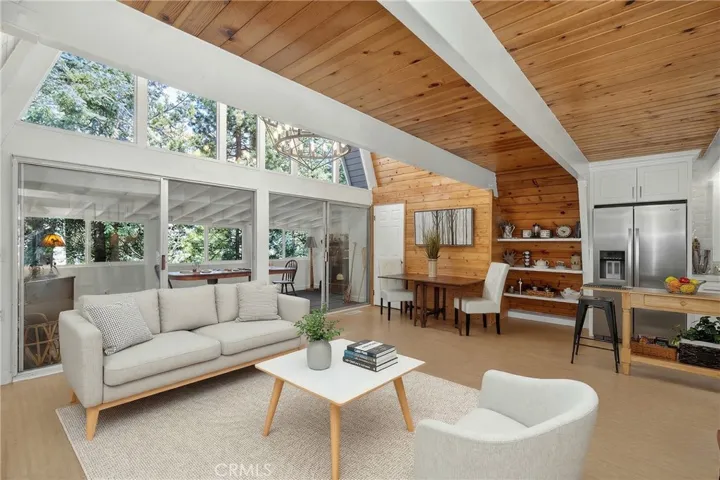 Sofa, coffee table, chair and rug are virtually staged.