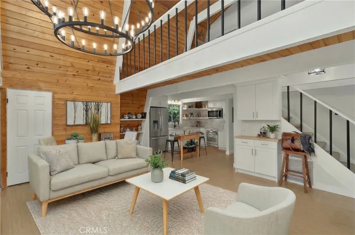 Virtually staged sofa, coffee table, chair, area rug.