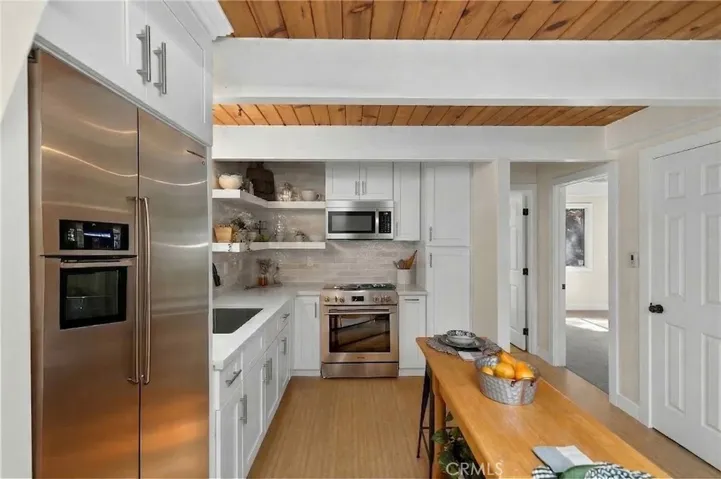 Refrigerator, microwave, and stove are virtually staged.