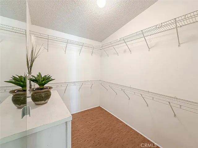 Walk in closet in primary bedroom