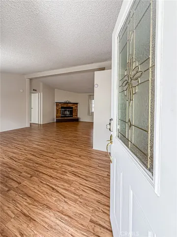 Entrance into large living/dining area with large fireplace