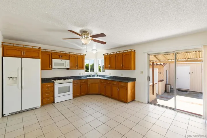 Spacious kitchen...patio door leads to backyard