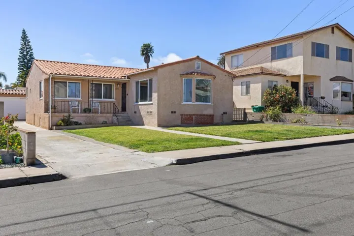 Front with long driveway. Garage set at rear of lot. Room for multiple cars (tandem) Rv or boat?