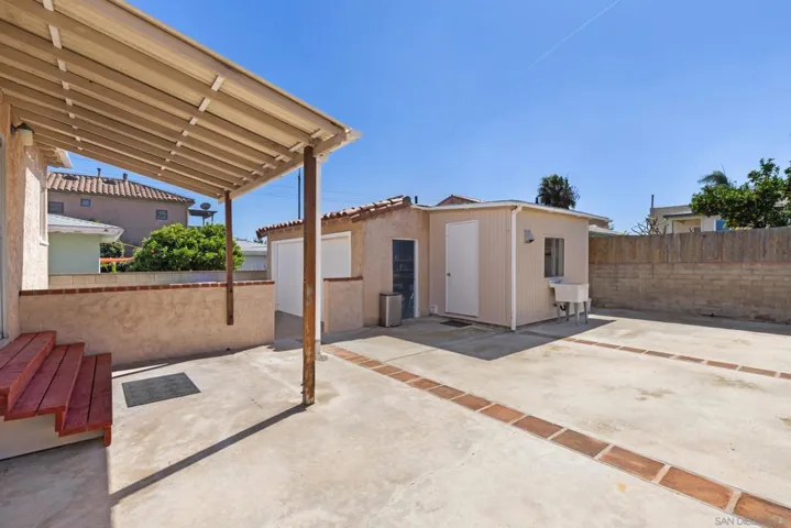 Patio area off the kitchen. View towards the 2 car garage and laundry room.