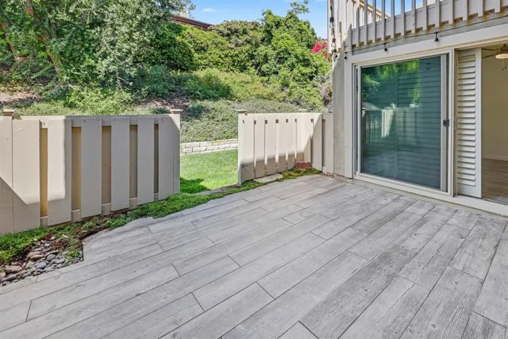 Fenced patio with gate to access greenbelt behind