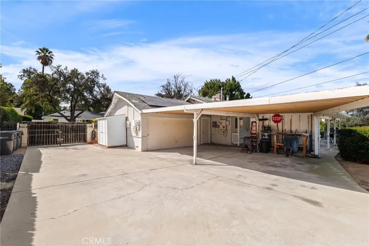 Enjoy easy garage access directly from the backyard, along with carports for plenty of extra parking space.