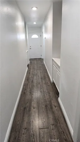 Hallway to upstairs bedrooms and bathroom
