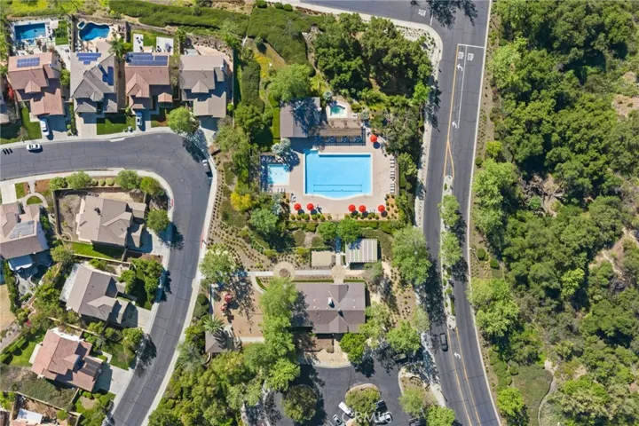 aerial view of the community pool and clubhouse area