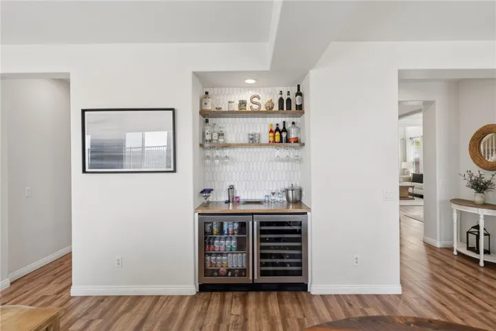 Dry bar in the family room with beverage fridge (conveys with home)