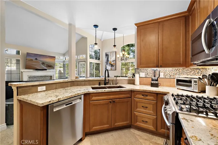 Remodeled kitchen with granite countertops and custom cabinetry