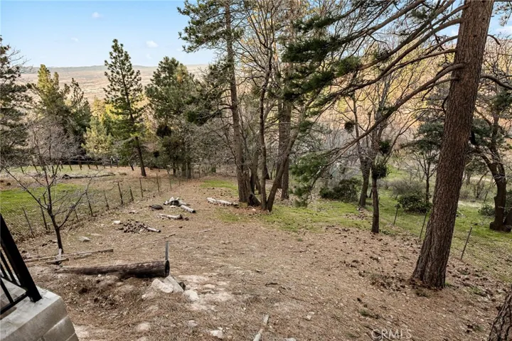 Large fenced yard with views.