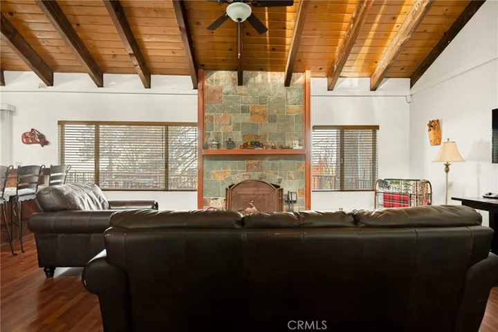 Living room with beautiful stone fireplace.