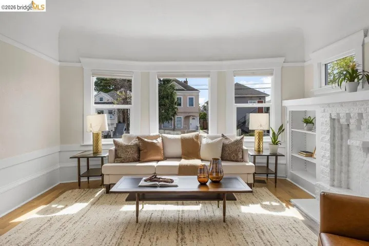 Living area featuring light wood-style floors and a wainscoted wall