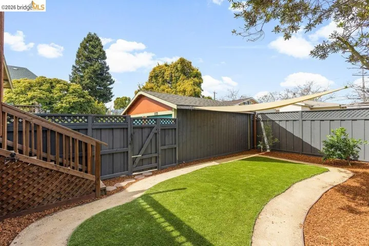 Fenced backyard with a gate