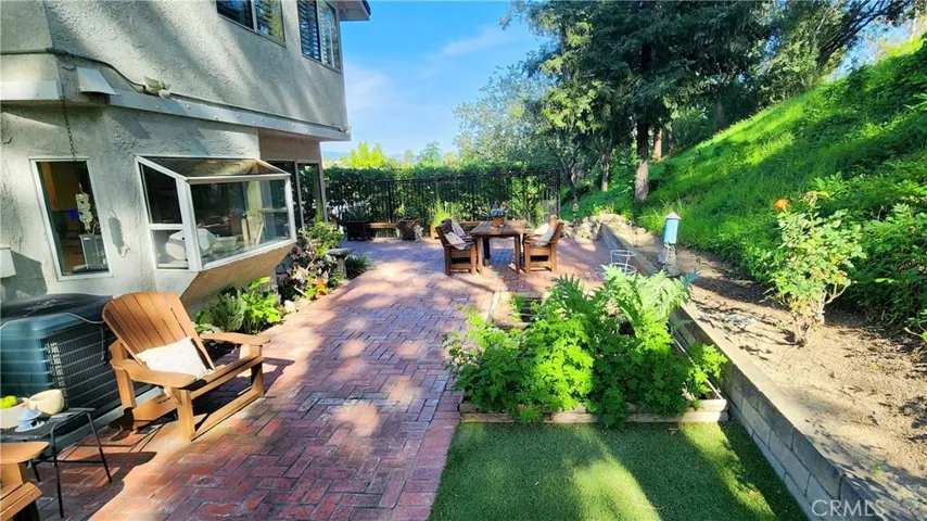 Rear yard with planters and grassy area