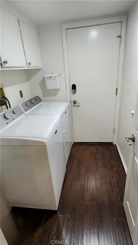 Laundry room with door to 3 car garage