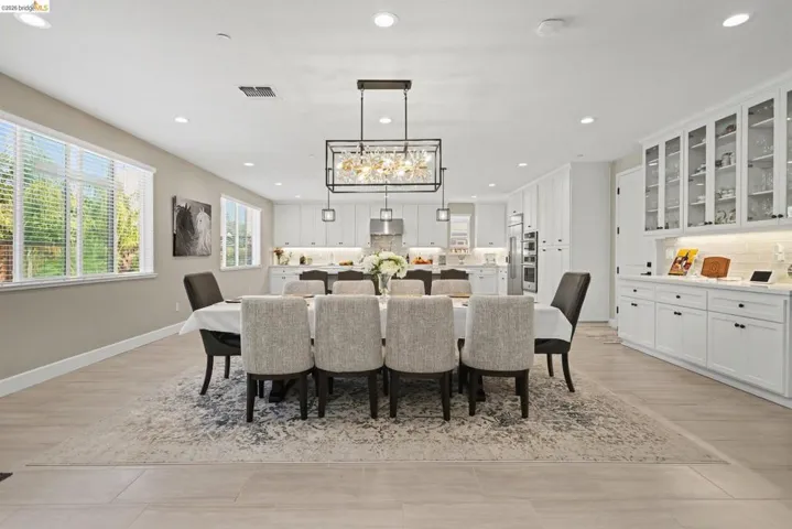 Dining room featuring hanging lights and light wood-style flooring
