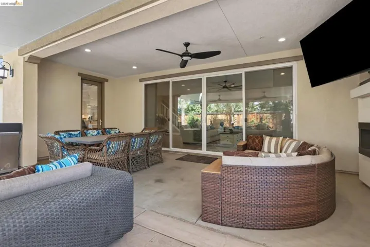 View of patio featuring outdoor lounge area and ceiling fan