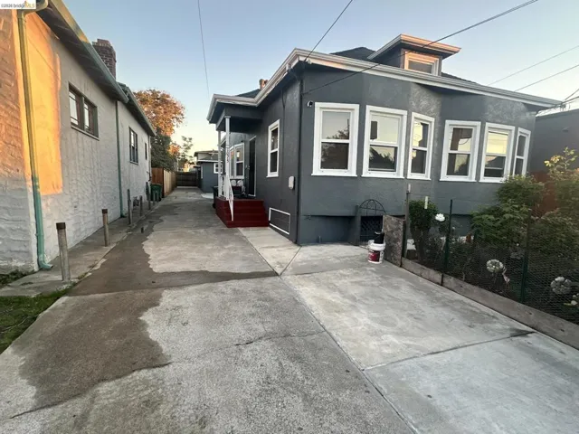 View of side of home with stucco siding