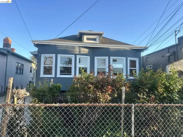 View of front of property with stucco siding, a porch, and a shingled roof
