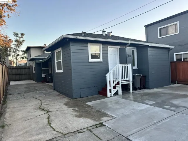 Rear view of house with roof with shingles