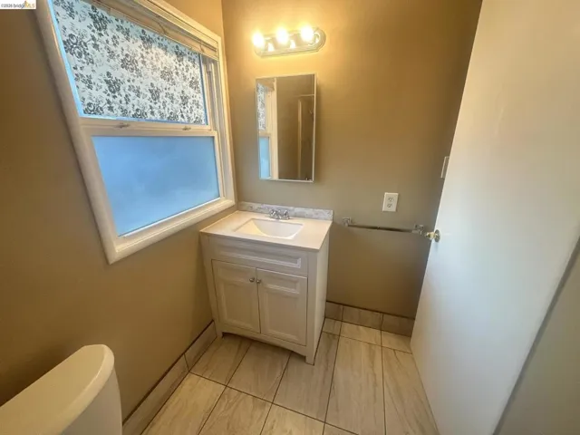Half bath with vanity and toilet