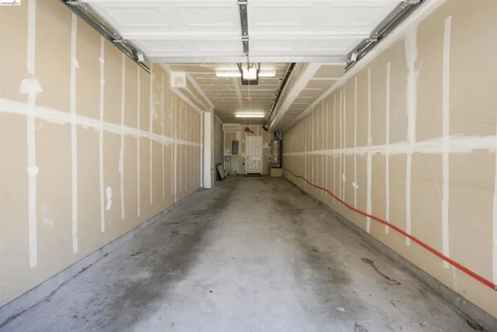 Garage with strapped water heater