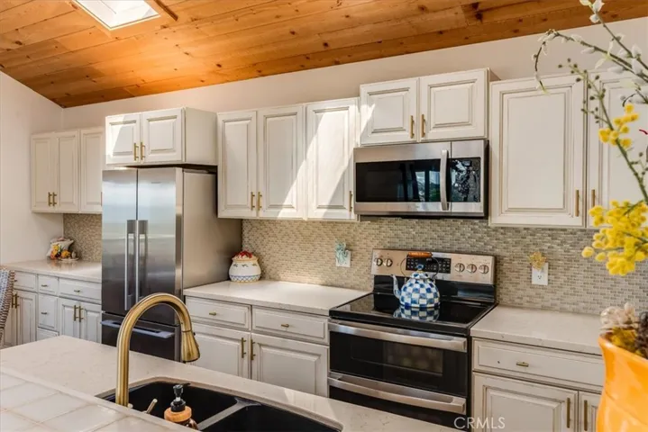 Closer view of kitchen from breakfast bar.