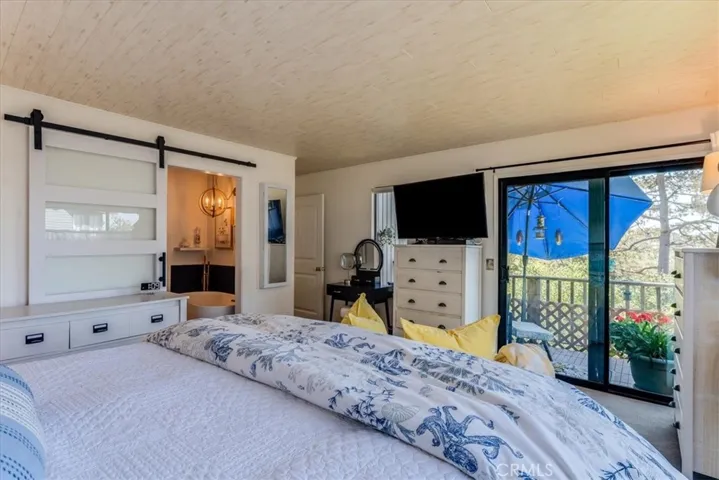 Other view of primary bedroom.