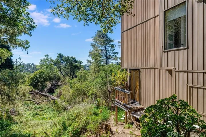 View of house showing alternate entrance to downstairs bedroom.