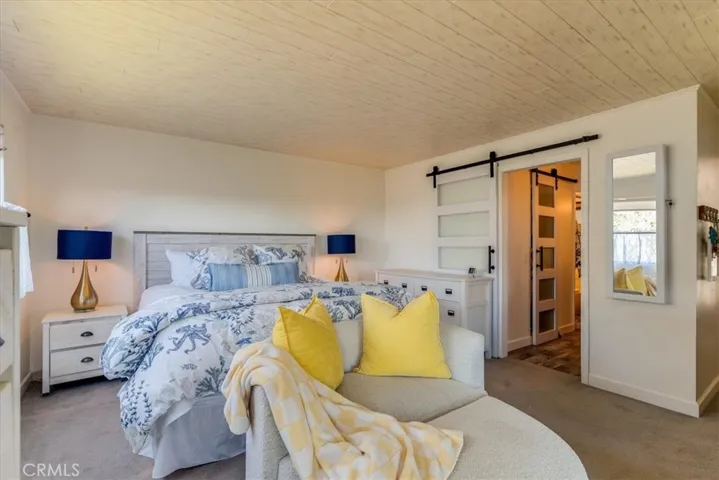 View from corner of bedroom looking towards bathroom and closet.