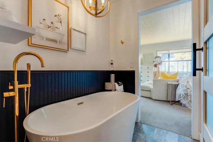 View from other side of primary bathroom towards bedroom.