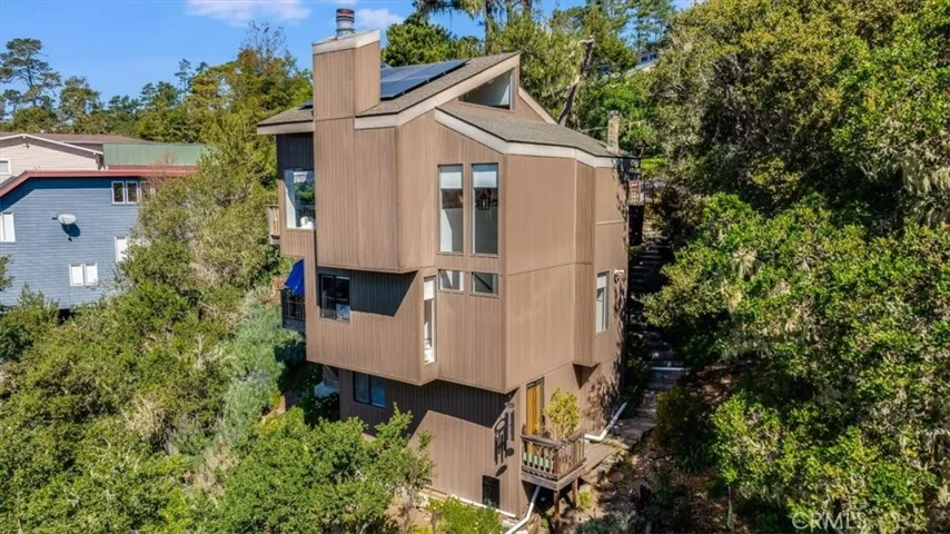 Another drone shot from the rear of the house showing the alternate entrance to the bottom room.