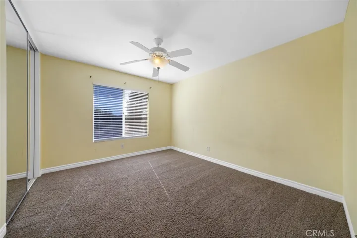 Secondary Bedroom With Neutral Tones And Ceiling Fan
