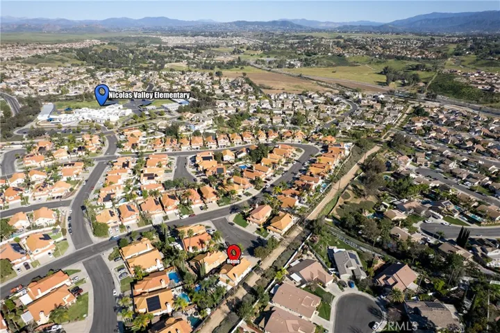 Wide Aerial View Of Murrieta Neighborhood With Rolling Hills In The Distance