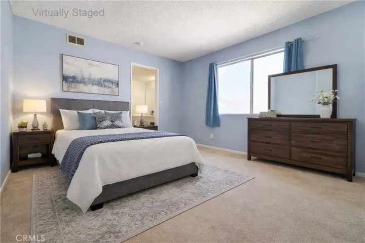 Bedroom with View to Vanity Area Virtually Staged