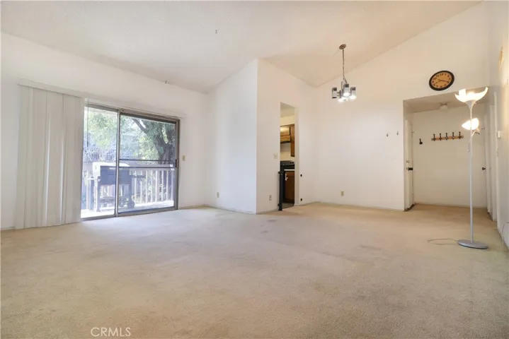 Living Room & Dine Area view to balcony