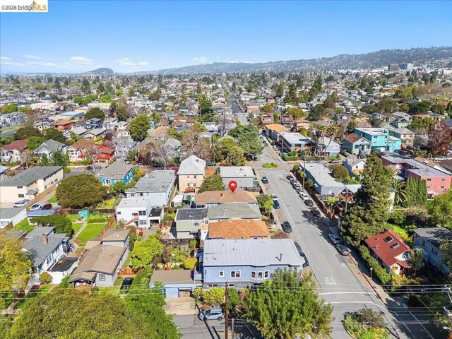 Aerial perspective of suburban area with a mountain backdrop