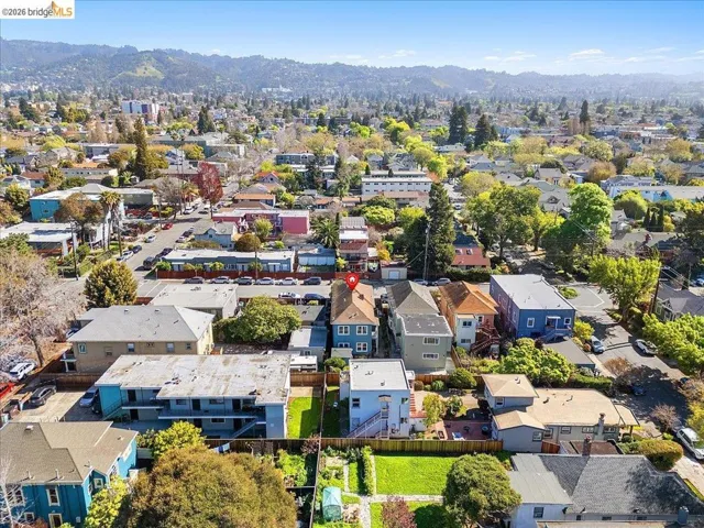 Aerial view of residential area featuring a mountain backdrop